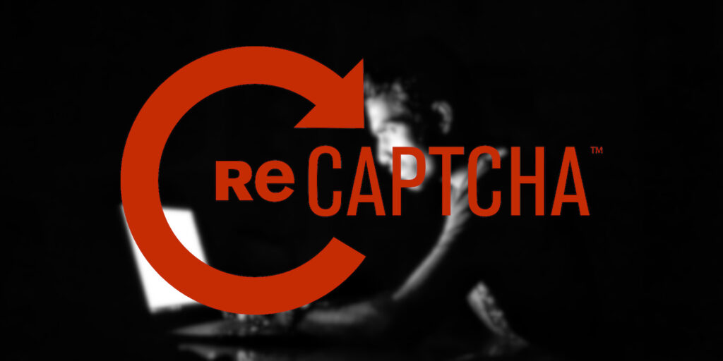 recaptcha text over image of young man on laptop