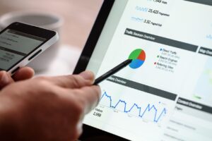 Hand pointing to chart smartphone cup