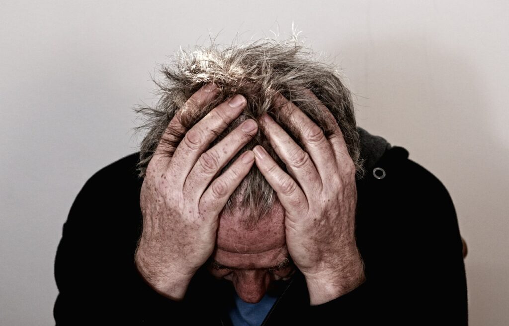 man holding his head