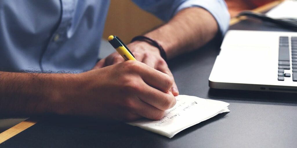 a man's hand writing