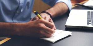 a man's hand writing