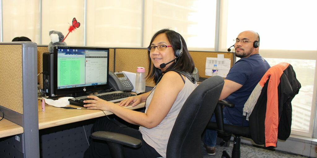 man woman working in front of the computer