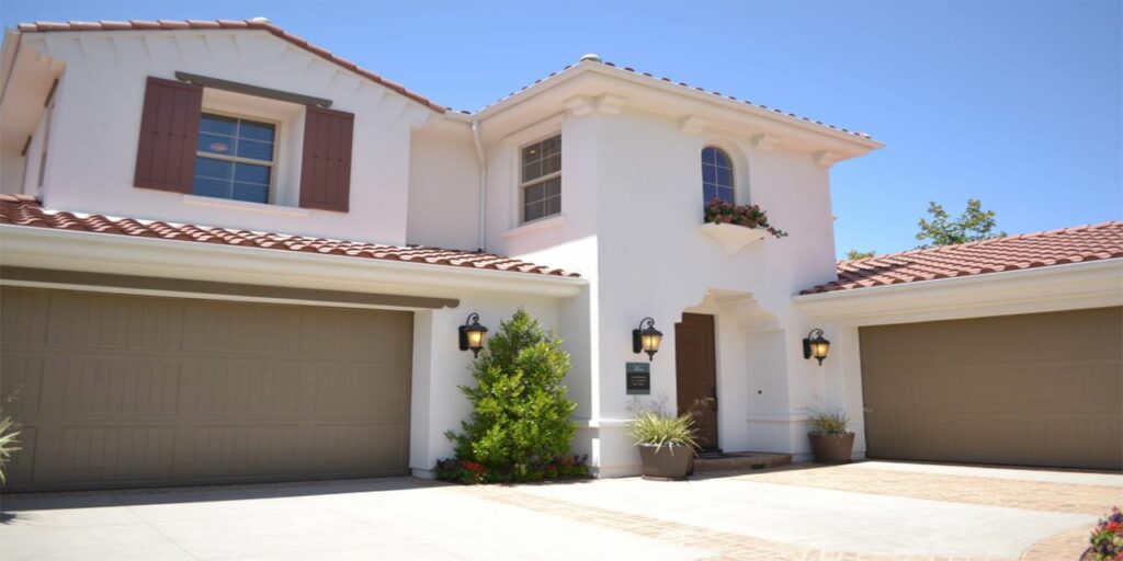 white concrete 2 storey house